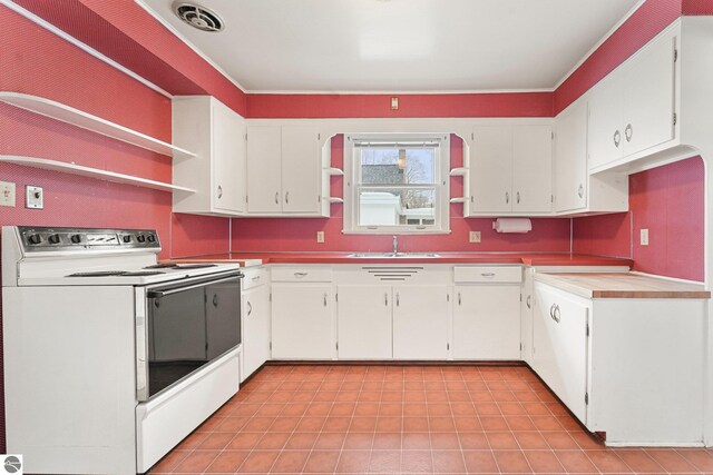 kitchen featuring visible vents, white cabinetry, open shelves, and white range with electric cooktop