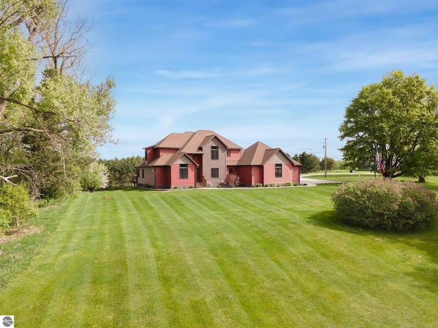 view of front of home with a front lawn