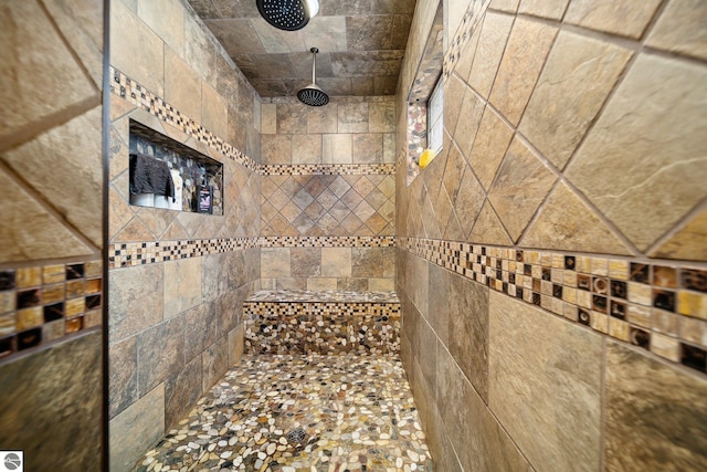 bathroom with tiled shower