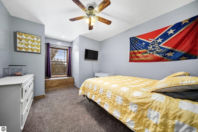 carpeted bedroom with ceiling fan and baseboards