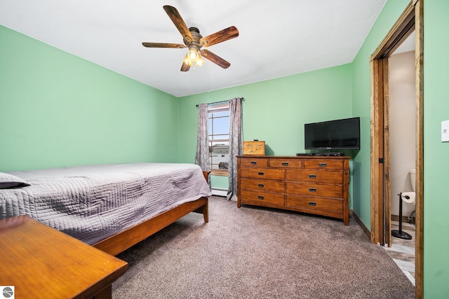 bedroom with a ceiling fan, carpet flooring, and baseboard heating