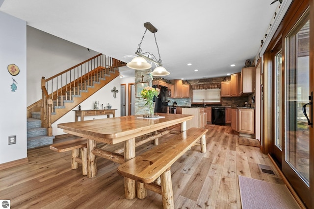 dining room featuring stairway, light wood-style flooring, visible vents, and recessed lighting