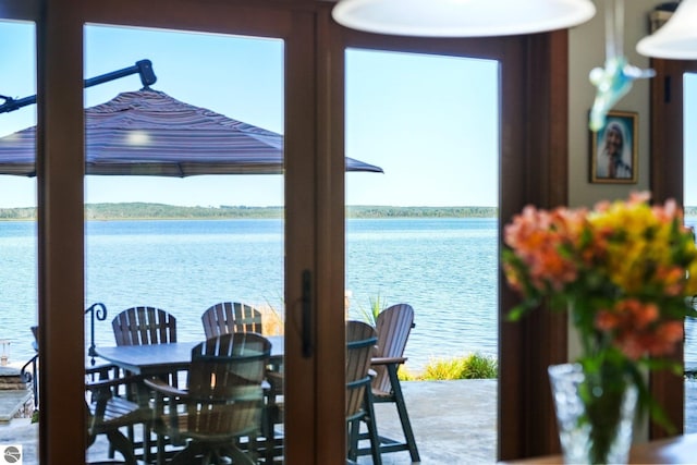 dining space with a water view