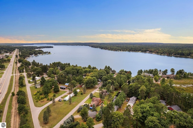 aerial view at dusk with a water view