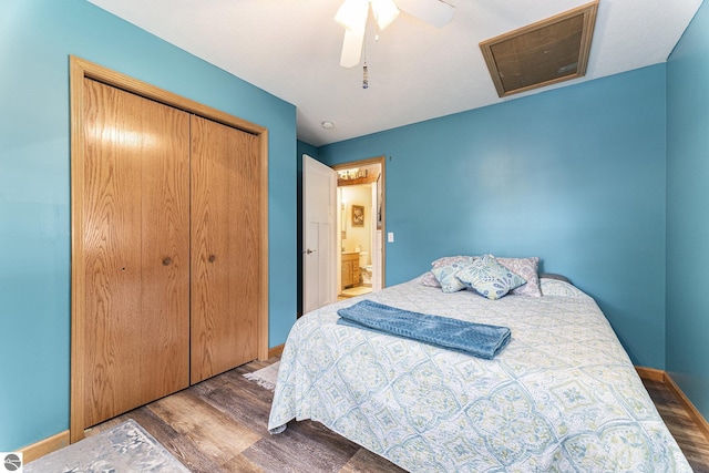 bedroom with a closet, dark wood-style flooring, ceiling fan, and baseboards