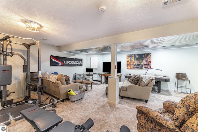 living area featuring baseboards, light colored carpet, visible vents, and a textured ceiling