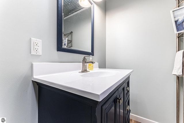 bathroom featuring baseboards and vanity