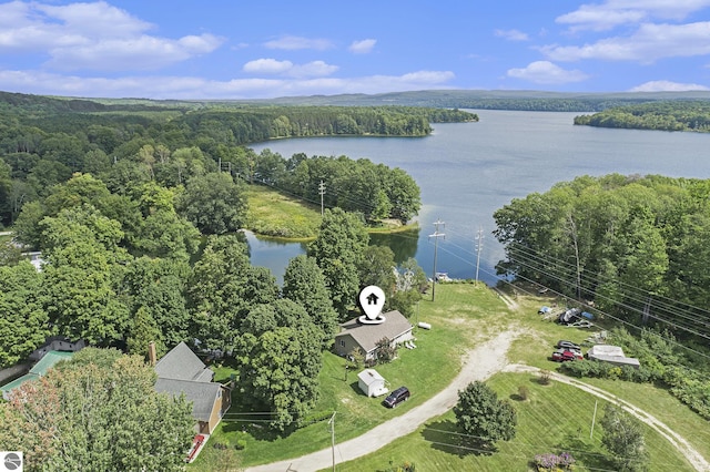 bird's eye view featuring a water view and a wooded view