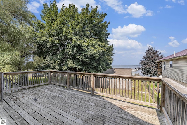 wooden terrace with a water view