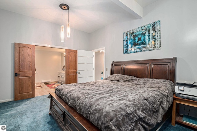 carpeted bedroom featuring baseboards
