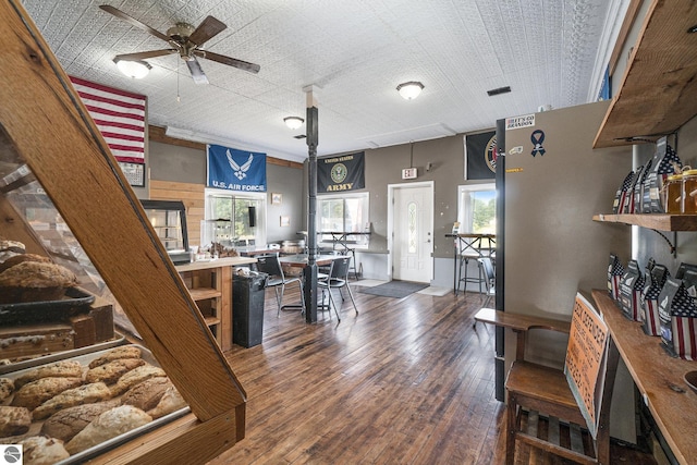 home office featuring hardwood / wood-style flooring and a ceiling fan