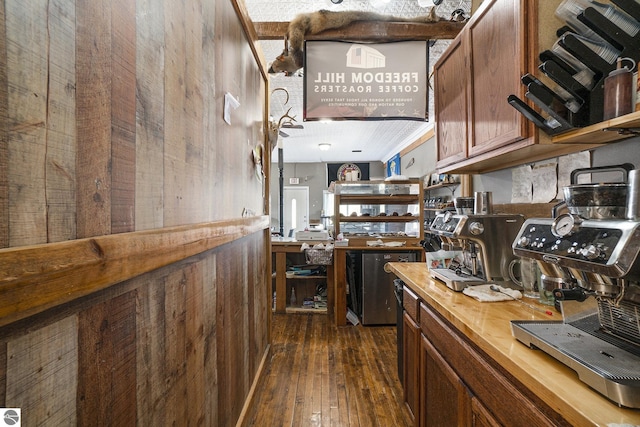 kitchen with wood counters, dark wood finished floors, and brown cabinets