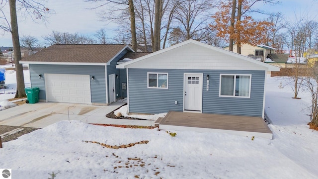 view of front facade with driveway and an attached garage