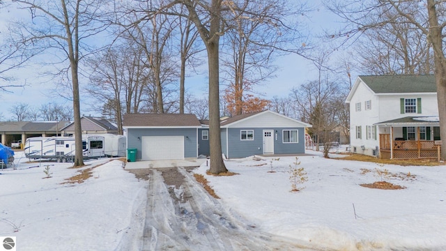 view of front of house featuring an outbuilding and an attached garage