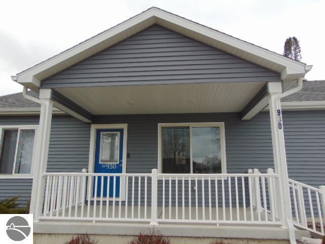 rear view of property with a porch