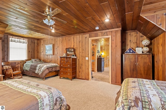 carpeted bedroom with wooden ceiling and wooden walls