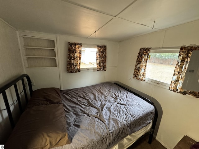 bedroom with multiple windows