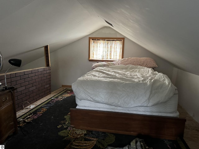 carpeted bedroom featuring vaulted ceiling