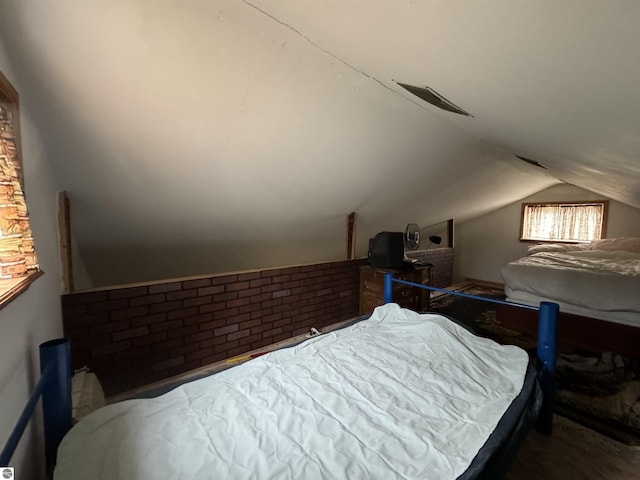 bedroom featuring vaulted ceiling