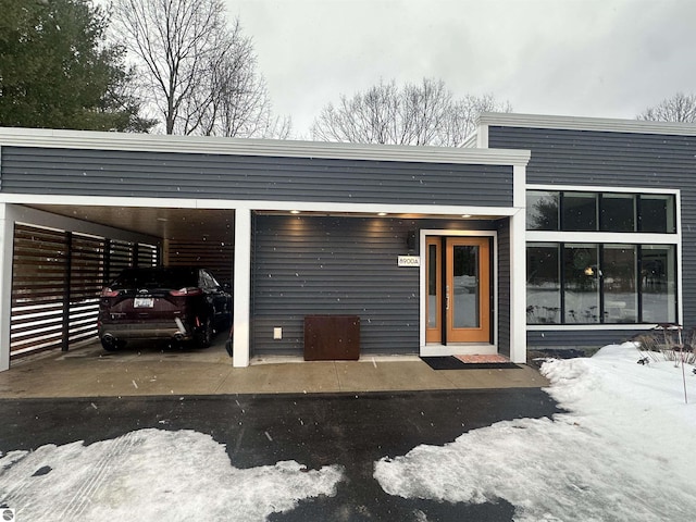 view of front of property featuring an attached carport