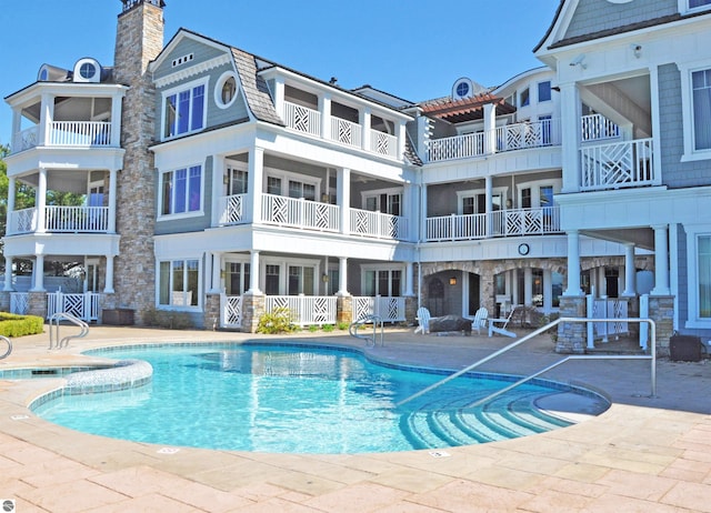 community pool with a patio