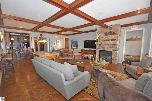 living area with coffered ceiling, a fireplace, billiards, baseboards, and beamed ceiling