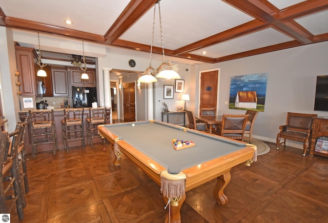 recreation room featuring beam ceiling, indoor bar, decorative columns, and baseboards