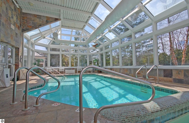 indoor pool featuring a lanai and a patio