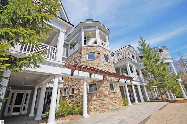 view of property featuring driveway and a garage