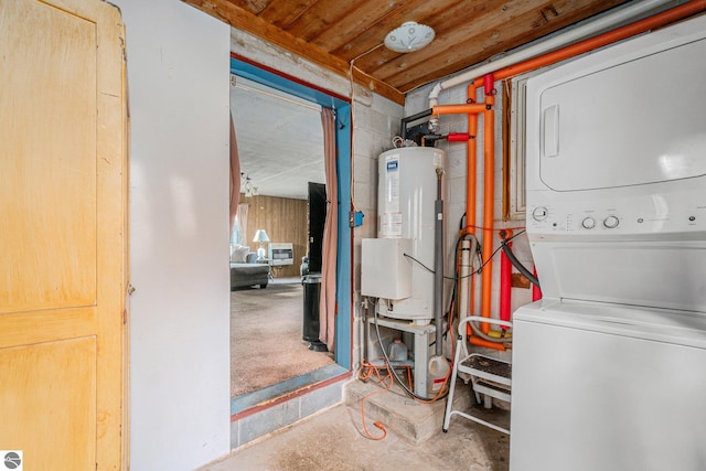 interior space featuring stacked washer and dryer, laundry area, and gas water heater