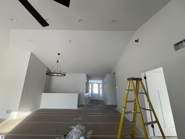 stairs with lofted ceiling and recessed lighting