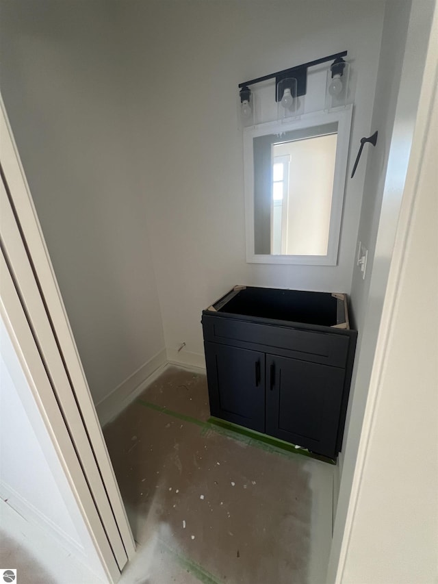 bathroom with vanity and baseboards