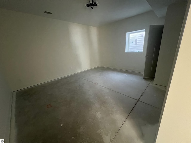 interior space with concrete floors and visible vents