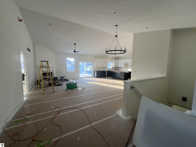 interior space featuring a high ceiling and a chandelier