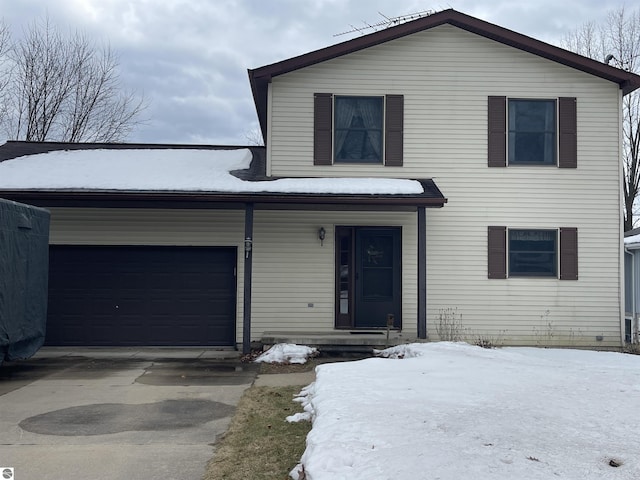 traditional-style home with driveway and an attached garage