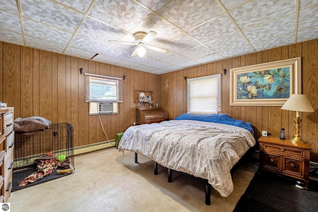 bedroom with wood walls, carpet, ceiling fan, and cooling unit