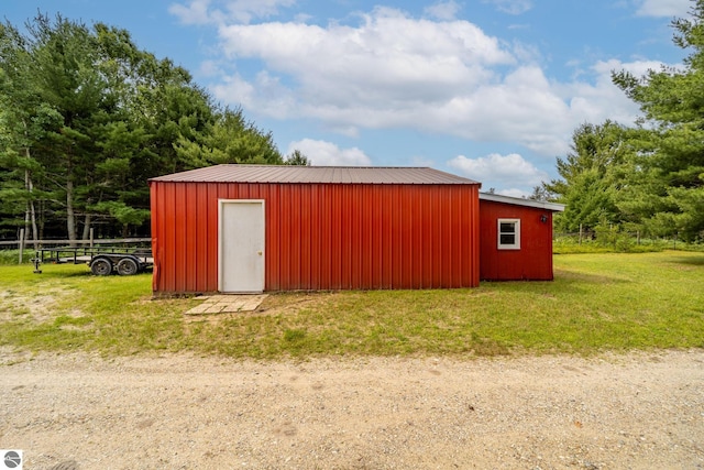 view of pole building with a yard