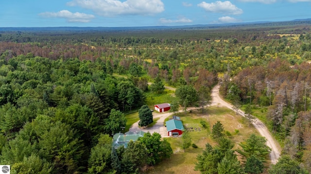 drone / aerial view featuring a view of trees