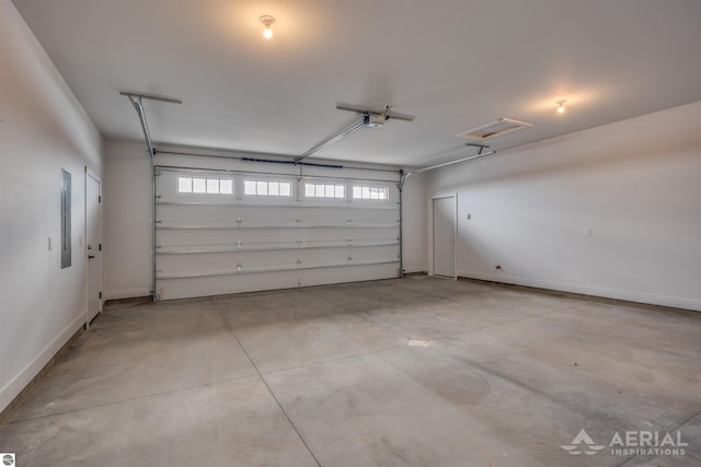 garage featuring electric panel, baseboards, and a garage door opener