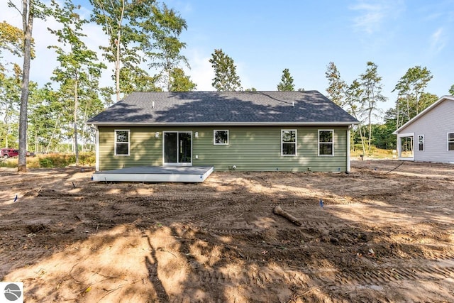 back of property featuring a wooden deck