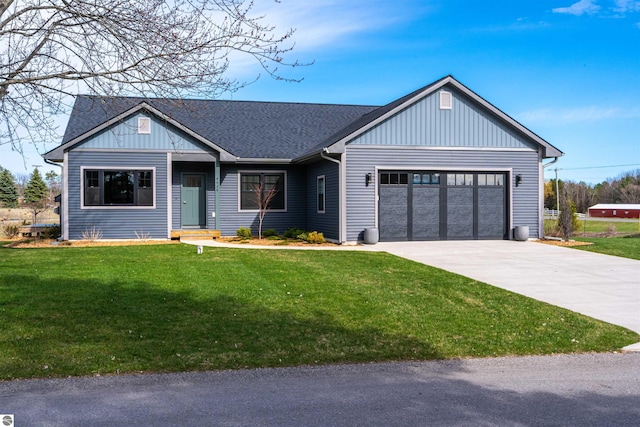 view of front of home with a front lawn, driveway, board and batten siding, and a garage