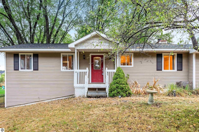 ranch-style home with a front lawn