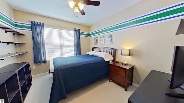 bedroom featuring carpet floors, a ceiling fan, and baseboards