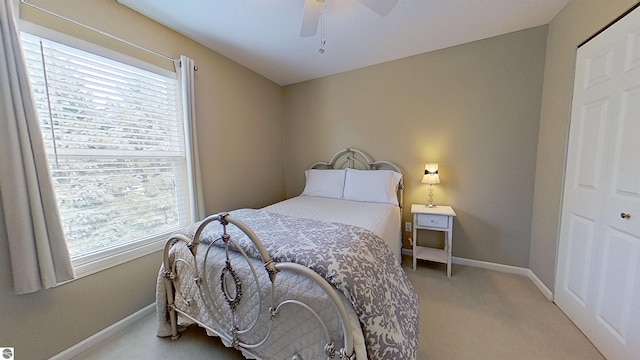 bedroom featuring a ceiling fan, carpet flooring, and baseboards