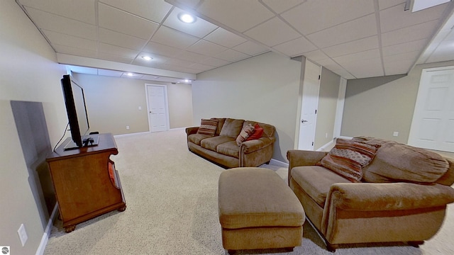 living room featuring a paneled ceiling, baseboards, carpet flooring, and recessed lighting