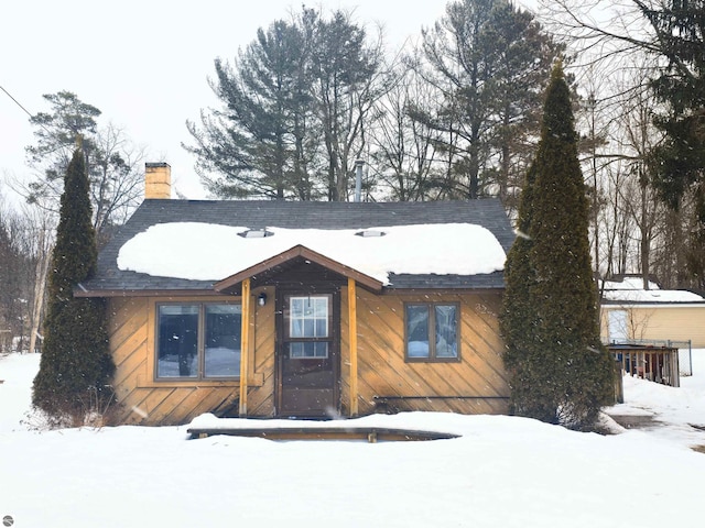 view of front of home featuring a chimney