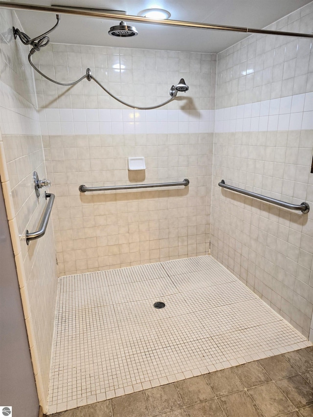 bathroom with tiled shower