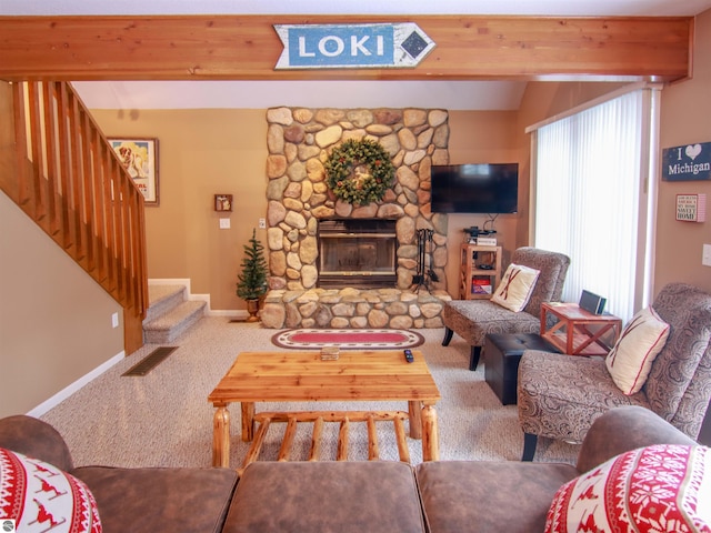 living room featuring baseboards, stairway, beamed ceiling, carpet, and a fireplace