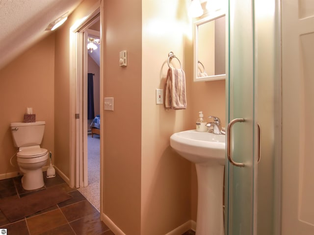 bathroom featuring toilet and baseboards