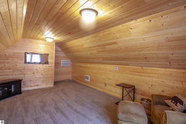 additional living space featuring visible vents, lofted ceiling, wooden ceiling, an AC wall unit, and wood walls